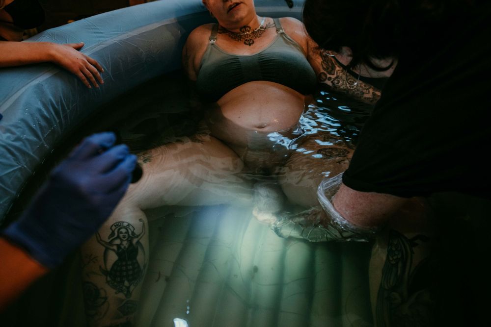 close up shot of moment of birth water birth photography portland oregon
