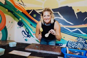 Vibrant mural with colorful swirls and geometric patterns on a wall.