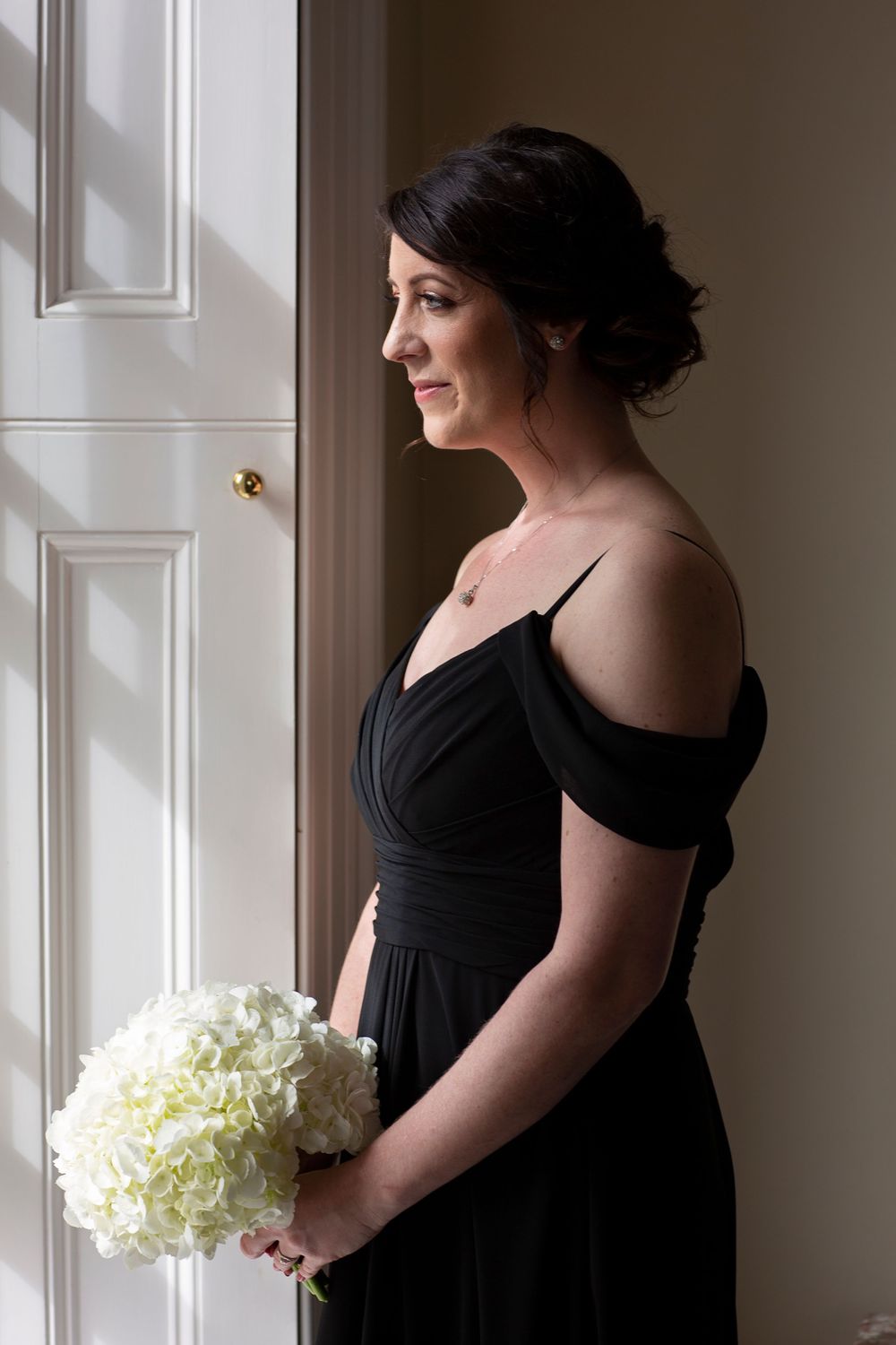 stunning bridesmaid photo in window at St Tewdrics House Chepstow