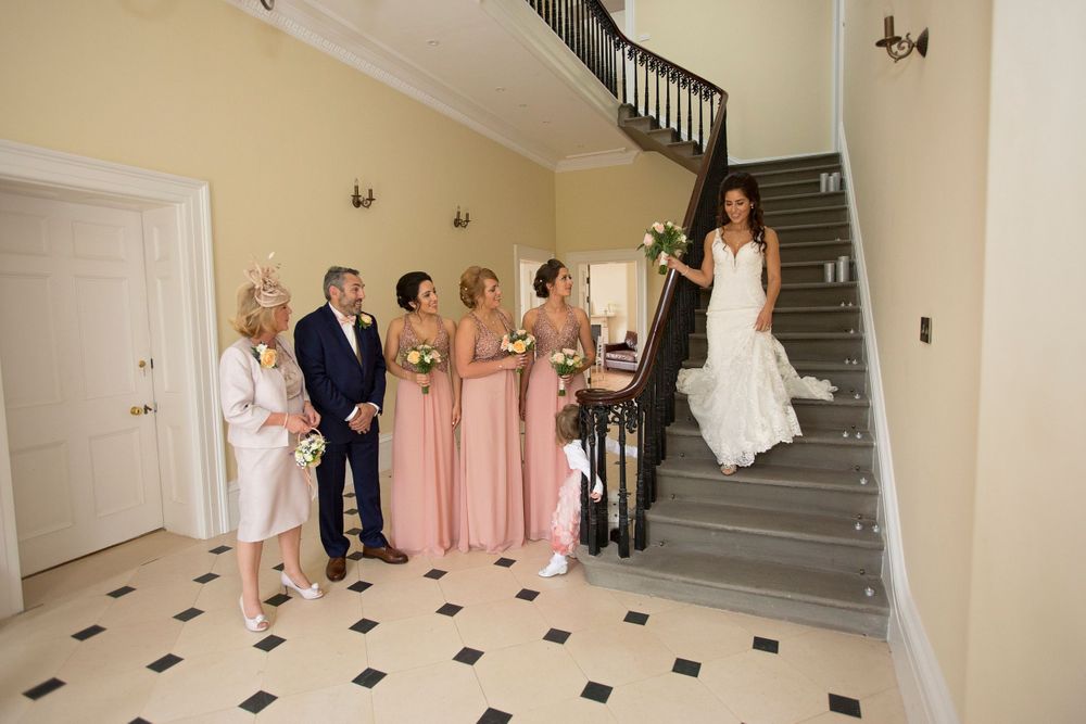 Her comes the bride on staircase at St Tewdrics House