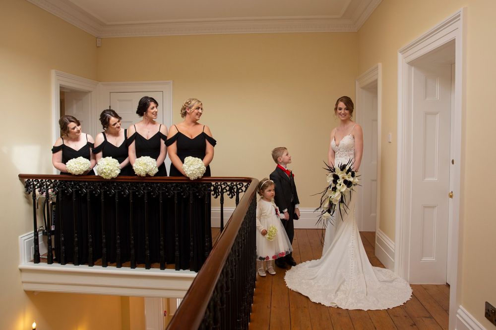 Bride and her Bridesmaid on stairs at St Tewdrics House