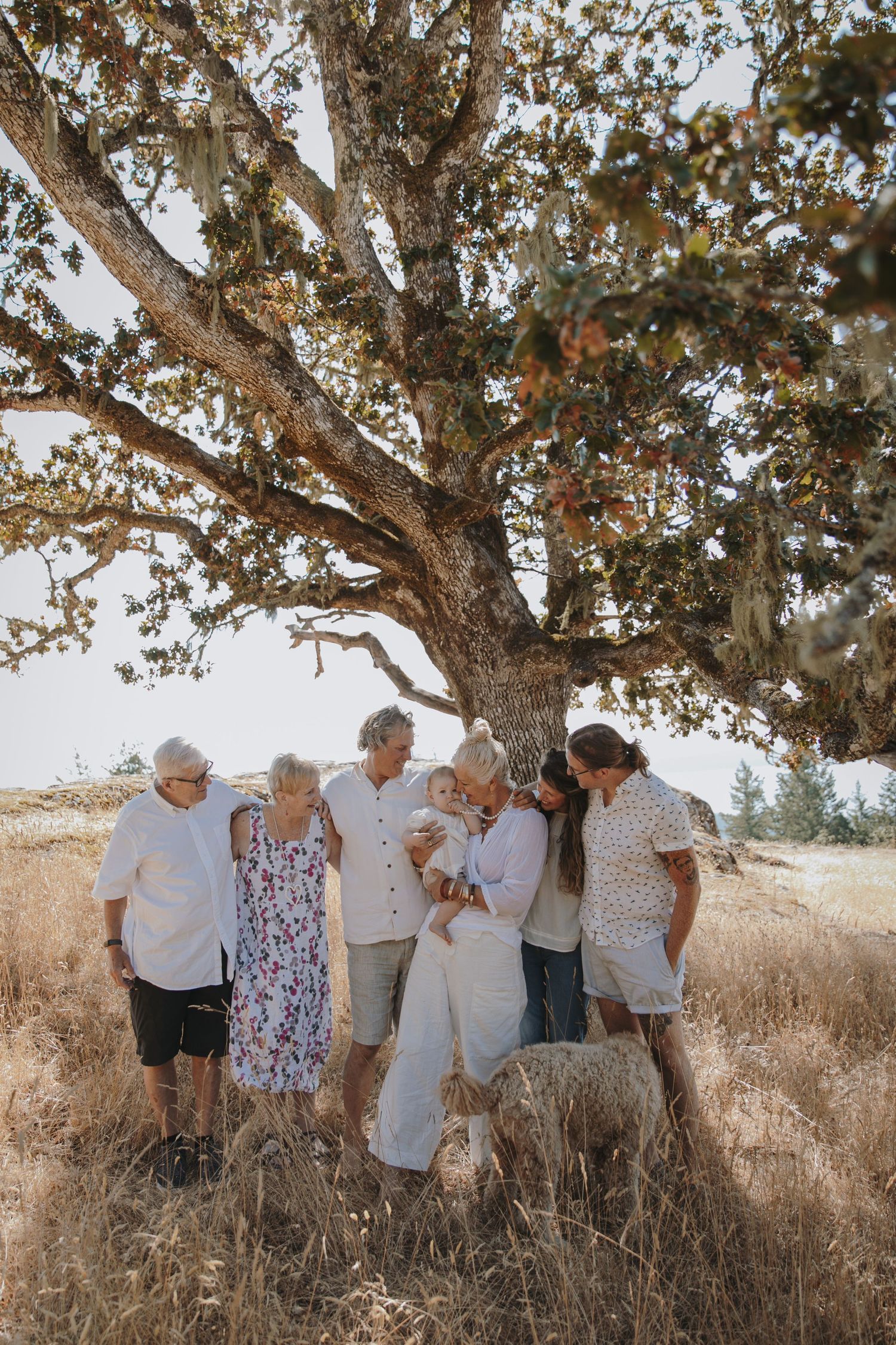 Extended family all gather around baby girl