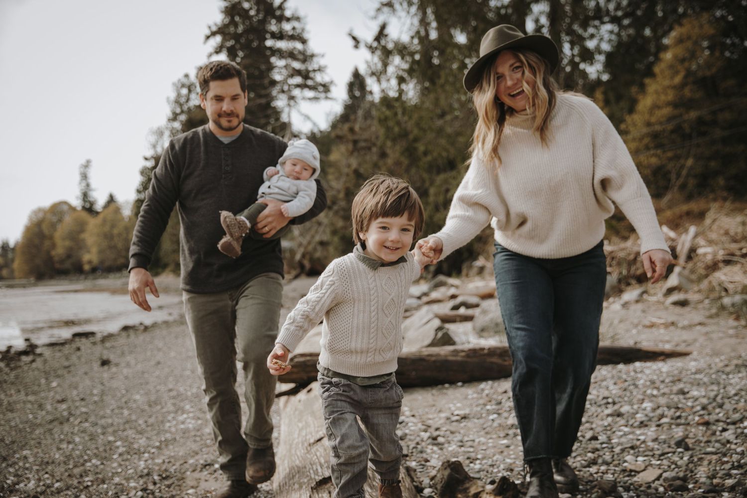 Family running along the beach
