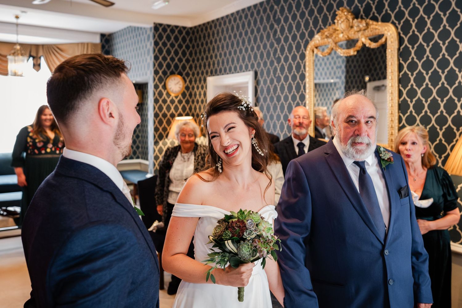 Bride laughs with groom at Wellington House Canterbury