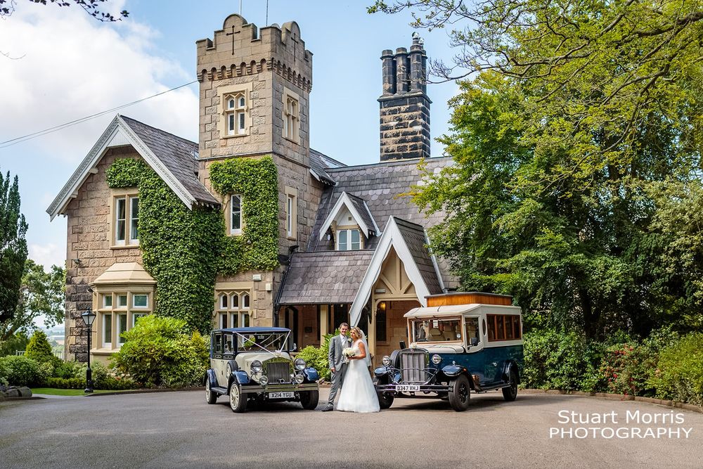 Bride and groom stand with their wedding cars in front of west tower country house wedding venue. Lancashire Wedding.