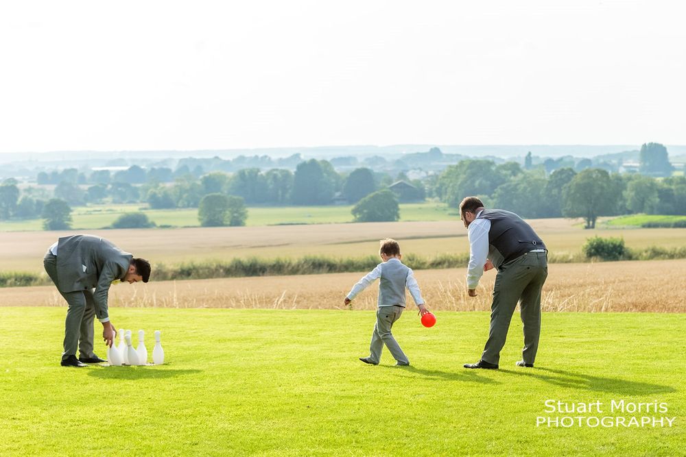 Groomsmen bowling in the grounds at west tower country house. Lancashire wedding photography