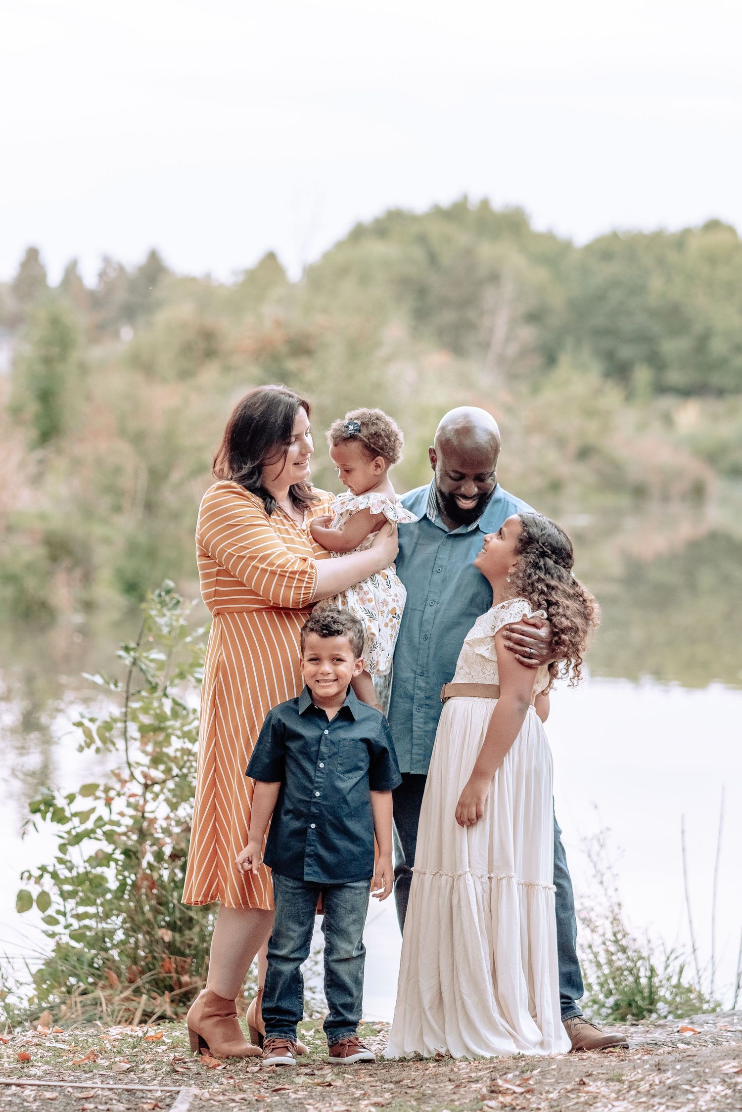 Multicultural family photoshoot by the lake in Oregon, Portland metro area, winter family photography PNW.