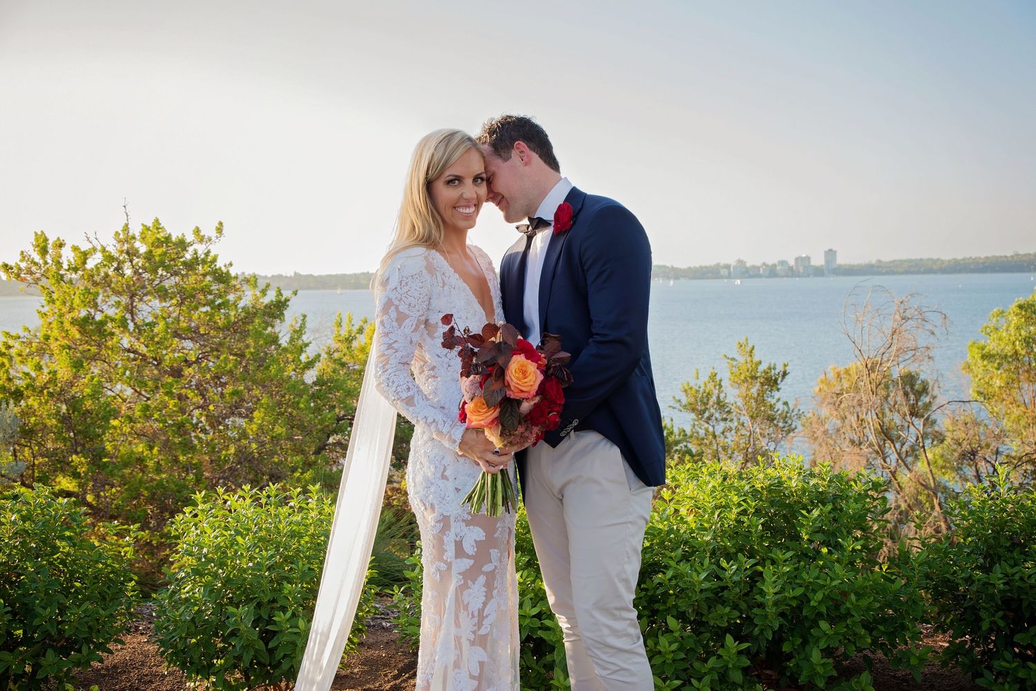 groom smiling at bride