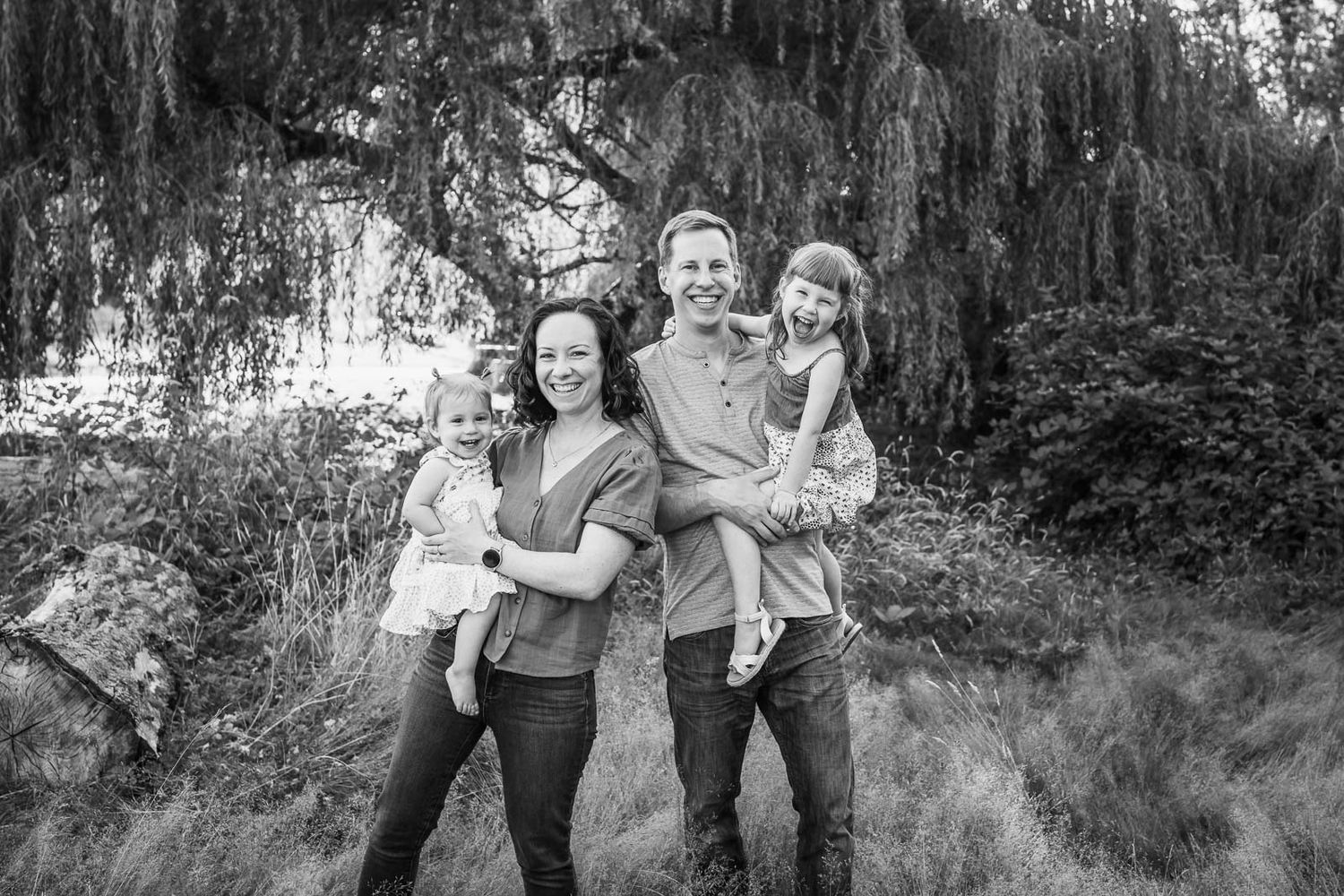 Black and white posed family photo at Juanita Bay Park.