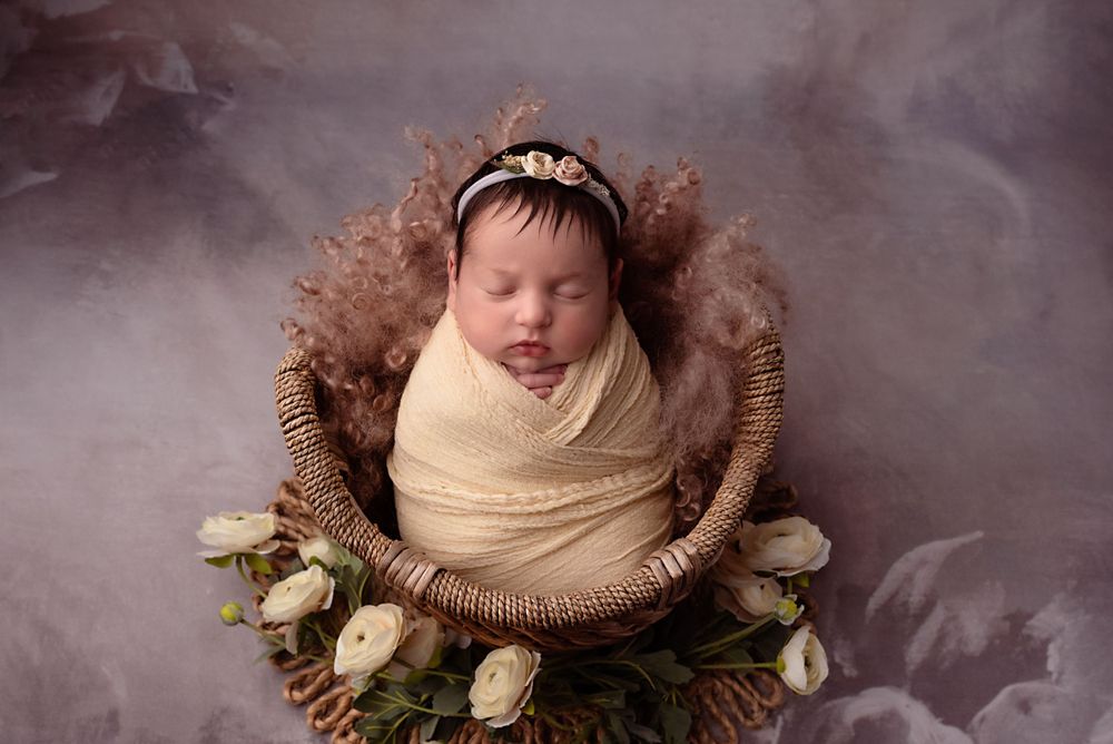 newborn baby wrapped in cream wrap Birmingham studio