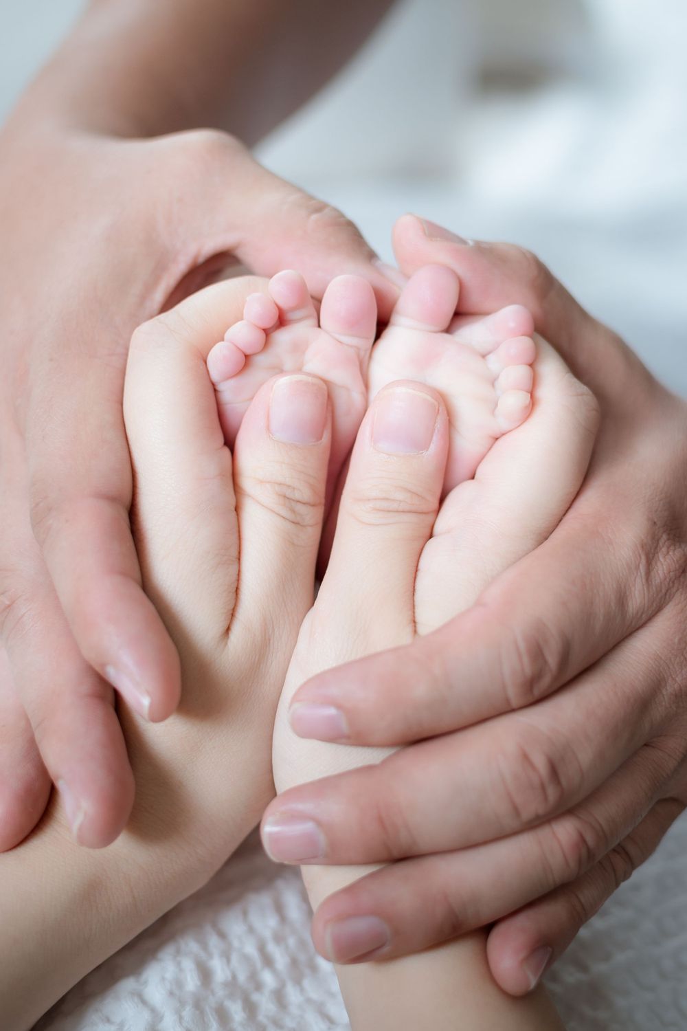 Close-up sequence of two hands holding each other in tender moments.
