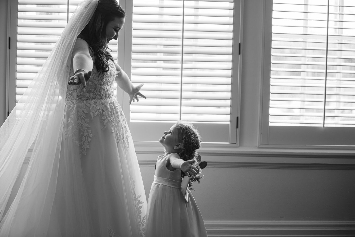 Wedding dress silhouette against window light in a series of getting ready photos.