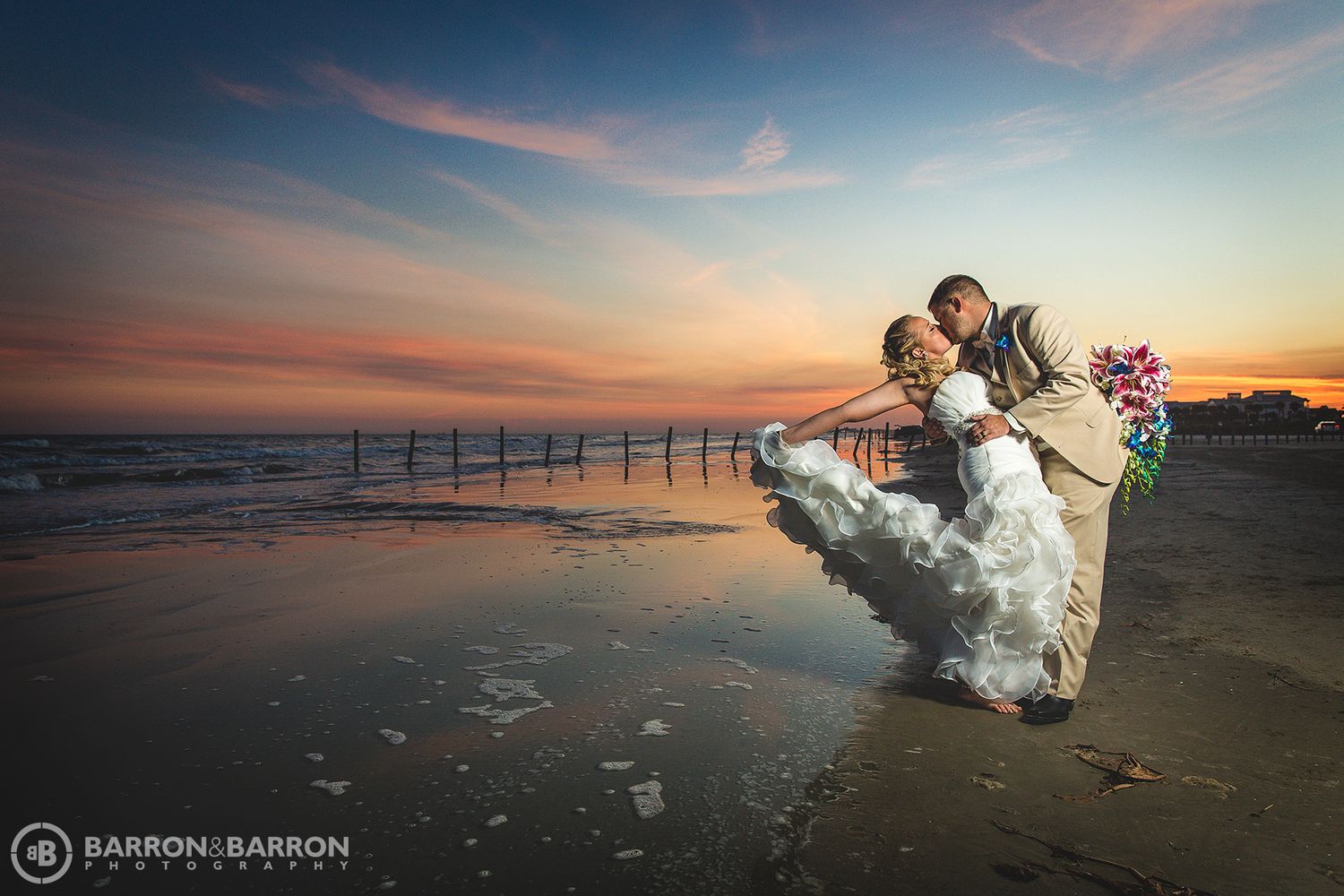 Dramatic sunset beach wedding photos with silhouettes against an orange and purple sky.
