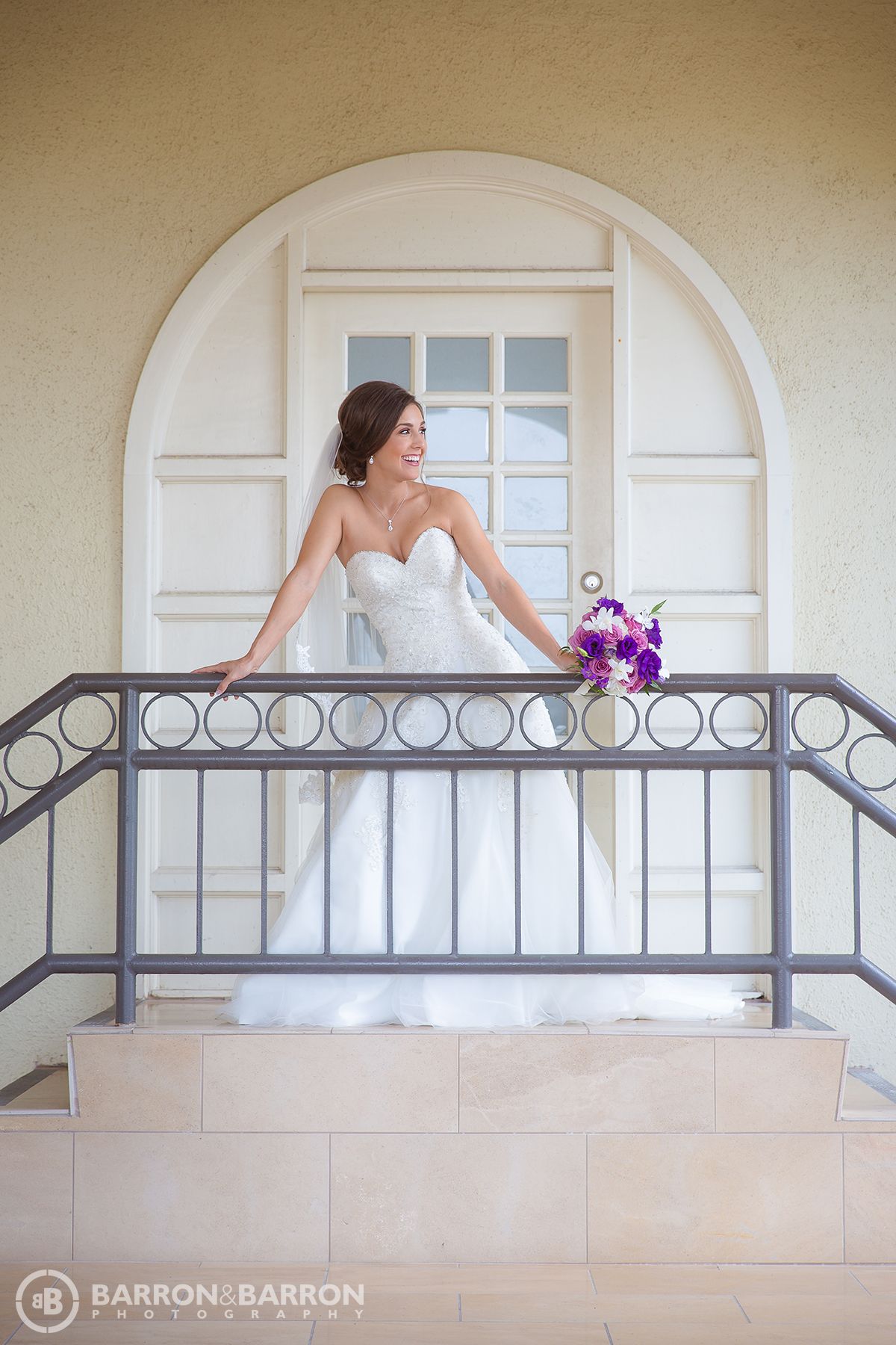 Artistic bridal portrait series showing a woman in white dress posing along an elegant balcony.