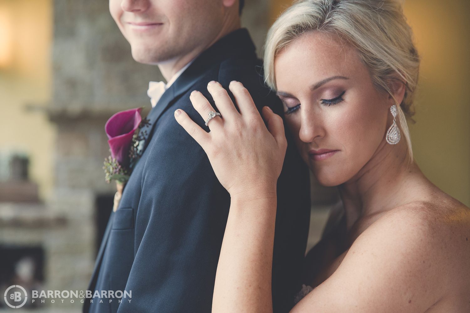 Intimate wedding portraits captured in warm lighting against a neutral background.