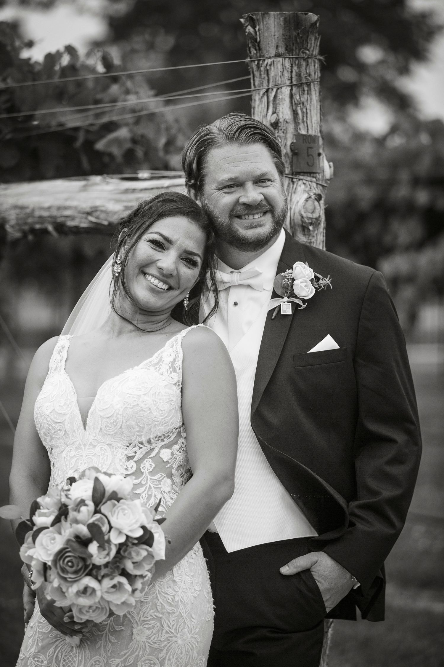 Black and white wedding portraits showing joyful moments with floral bouquet.