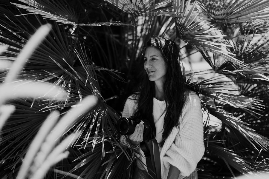 Black and white artistic portraits with palm fronds creating dramatic shadows.