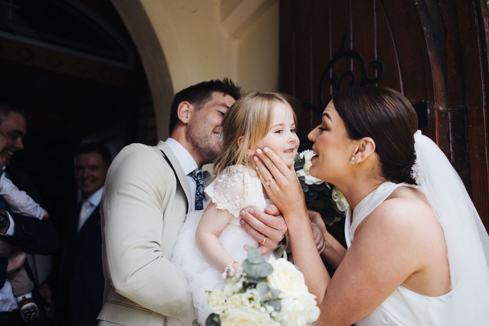 Emotional moment at wedding ceremony as participants express joy and affection.