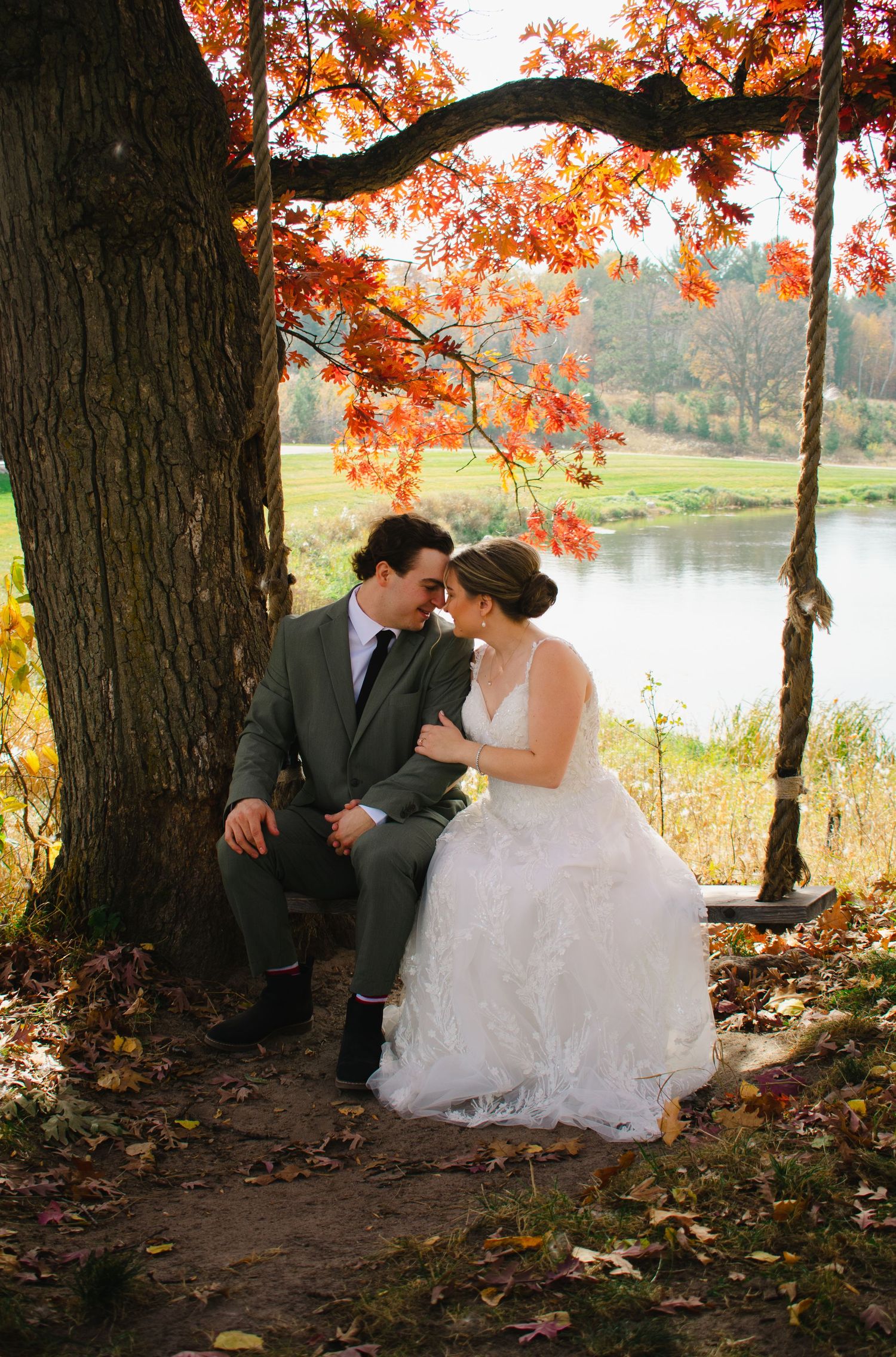 Wedding Photography - S+T on a rope swing together during their first look in Cushing, Minnesota