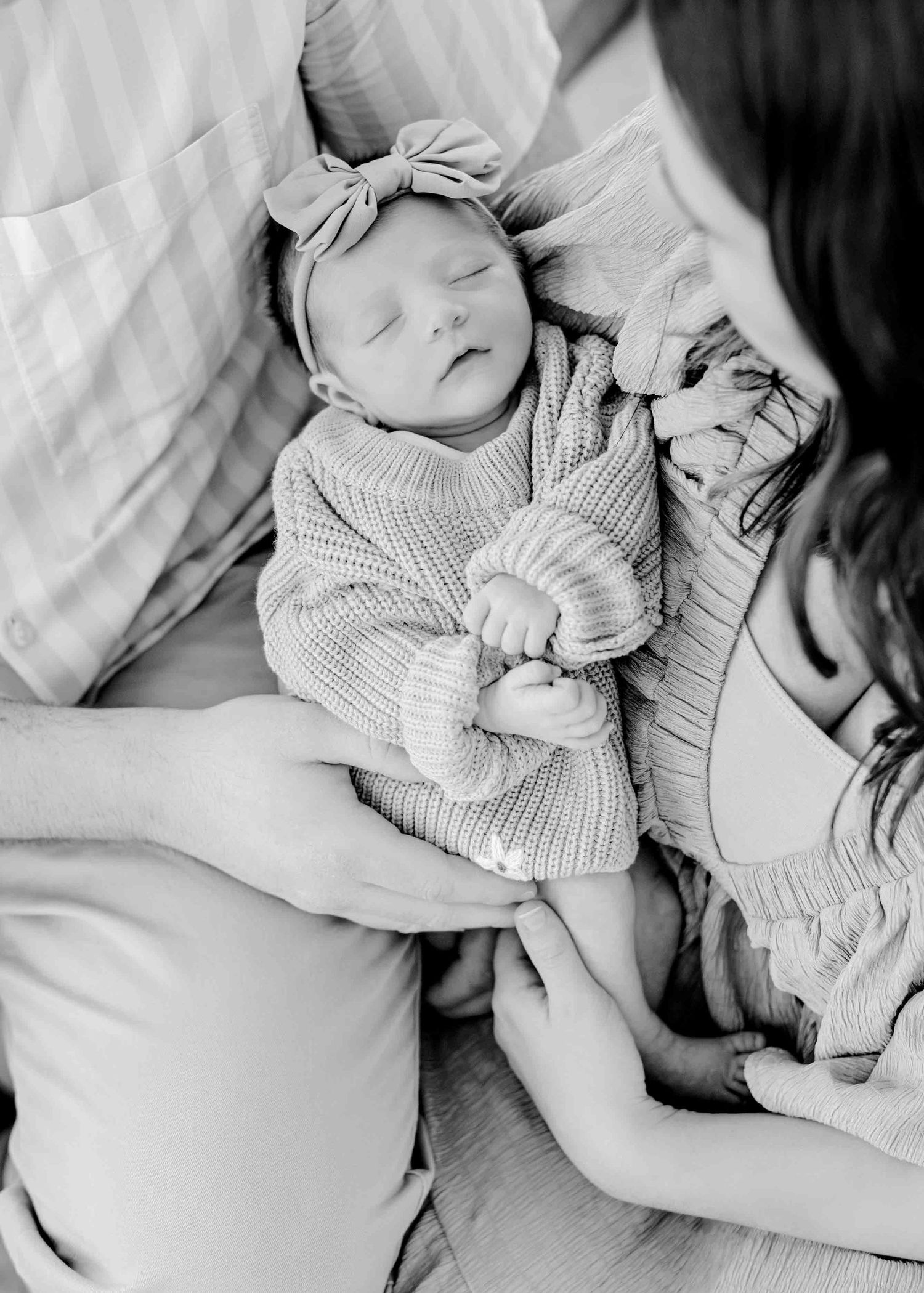 Peaceful black and white indoor portrait of a sleeping baby.