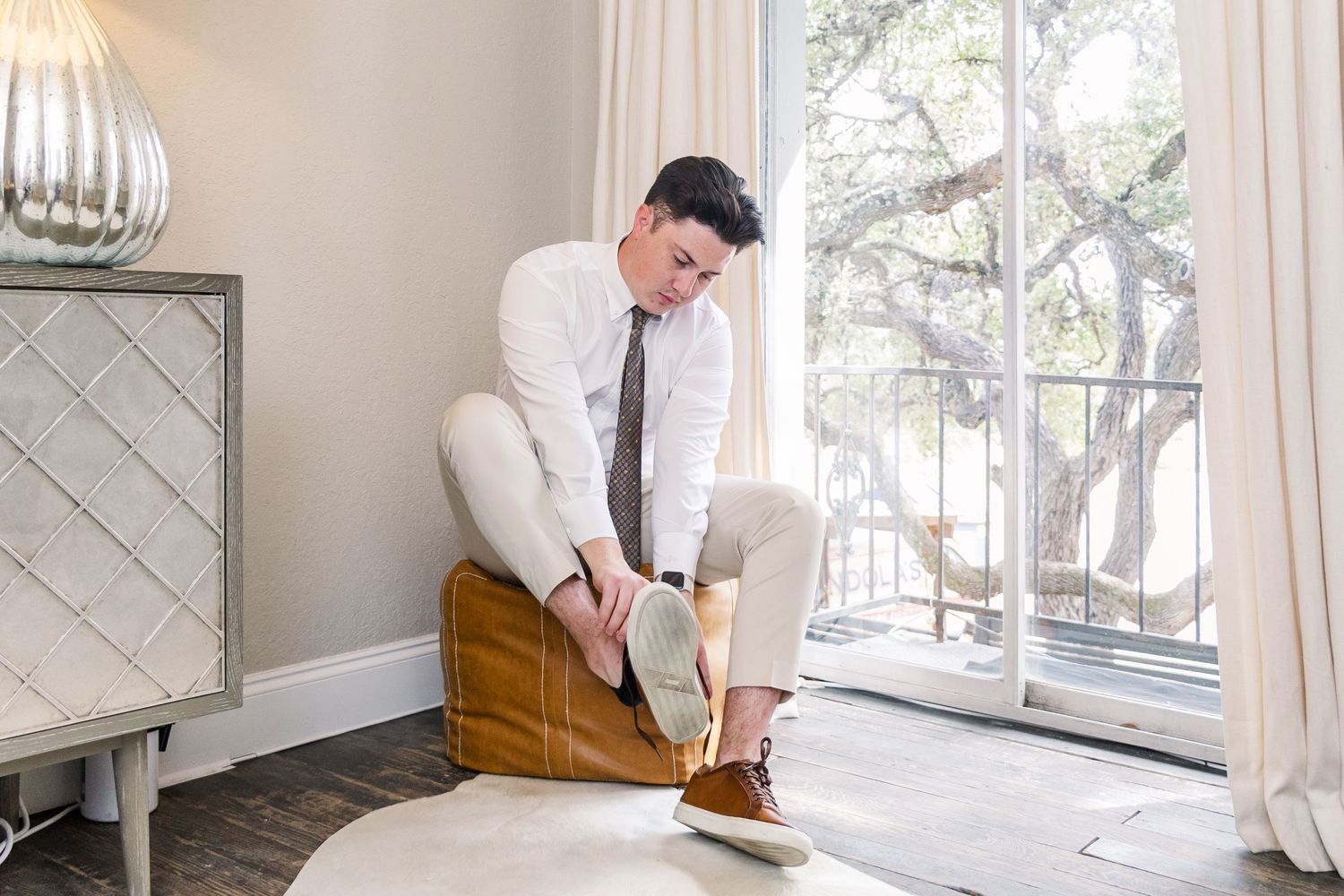 groom getting ready at Stonehouse Villa