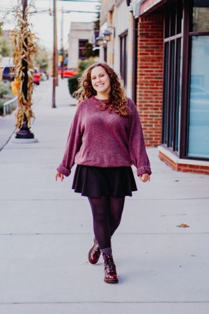 Autumn street style portrait in burgundy sweater and skirt.