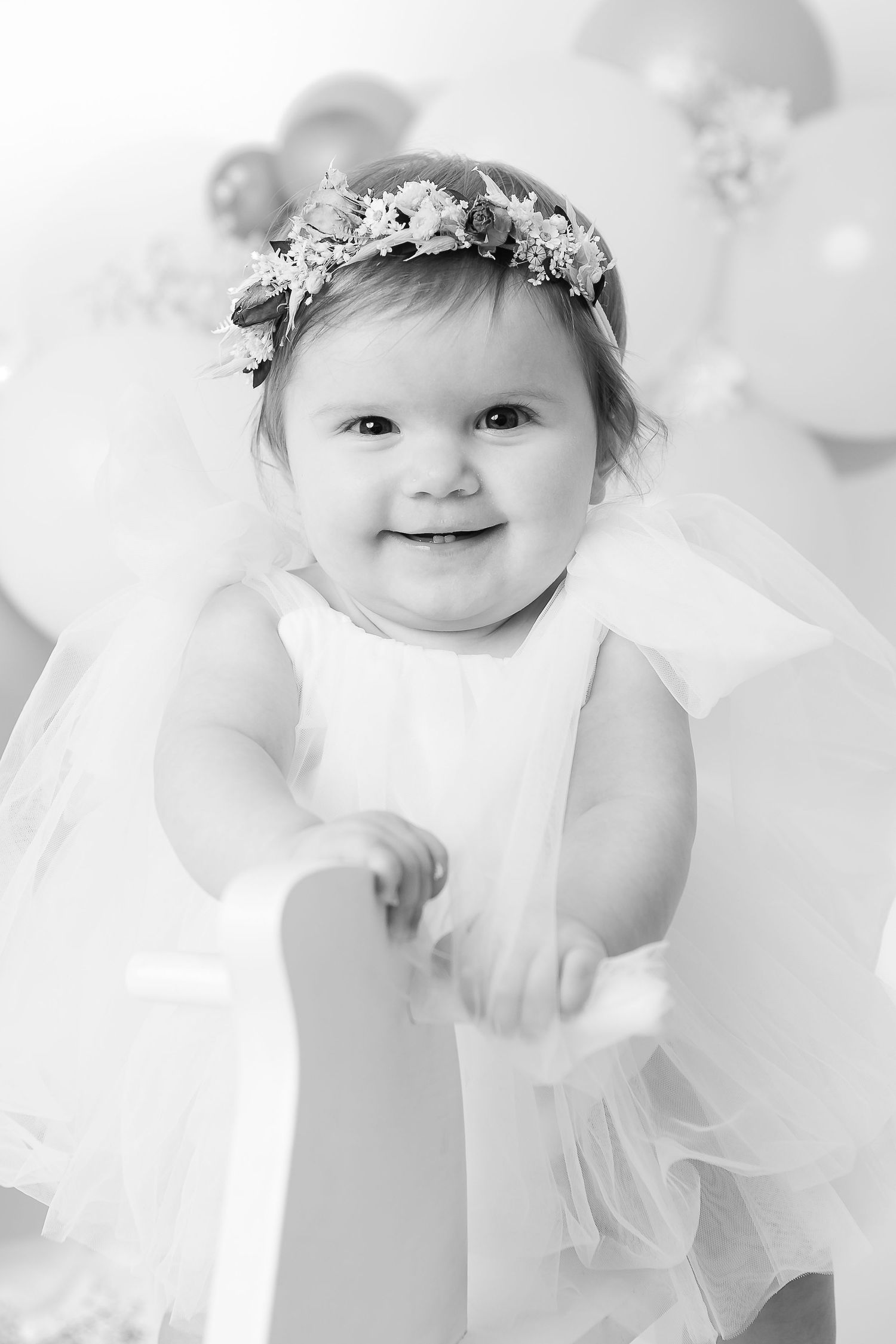 Sweet black and white portrait showing a delightful expression.