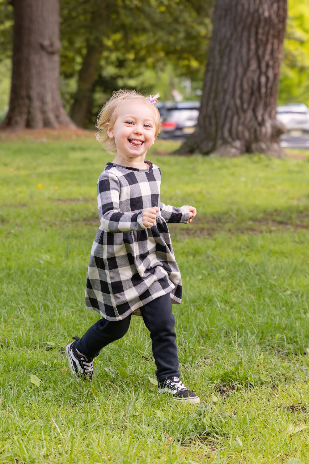 child sticking out her tongue while running away at croft farm in cherry hill camden county