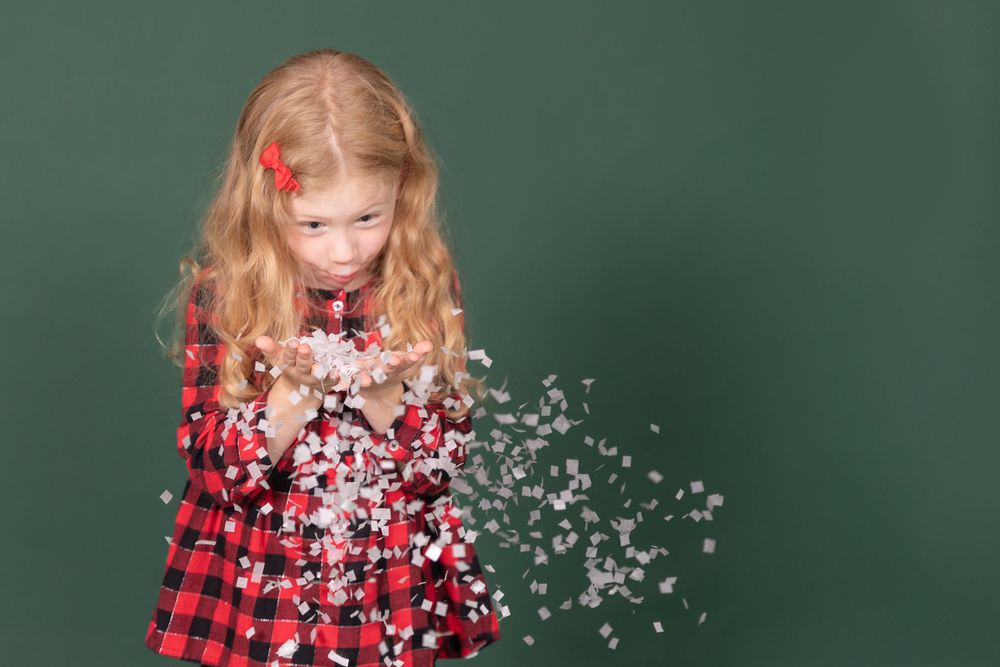 child making silly face savage evergreen paper backdrop in studio in clayton new jersey Gloucester county