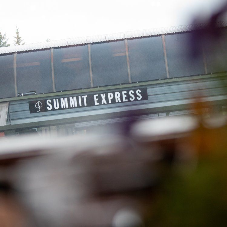 Close up shot of a Summit Express ski lift sign.