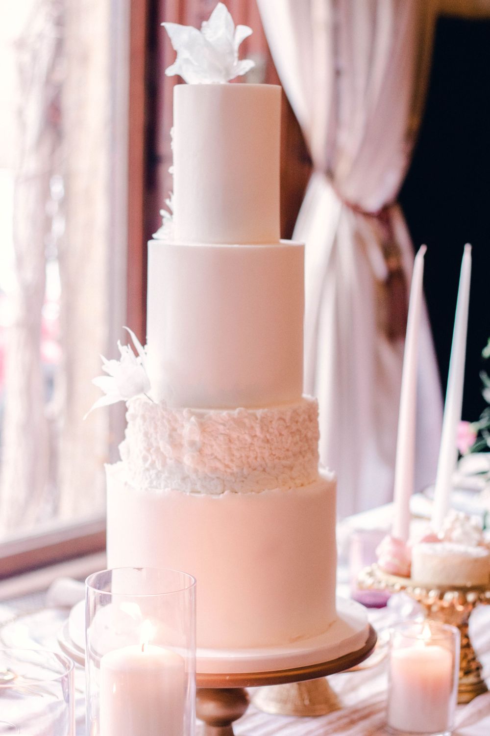elegant wedding cake manor by the lake cheltenham wedding photographer