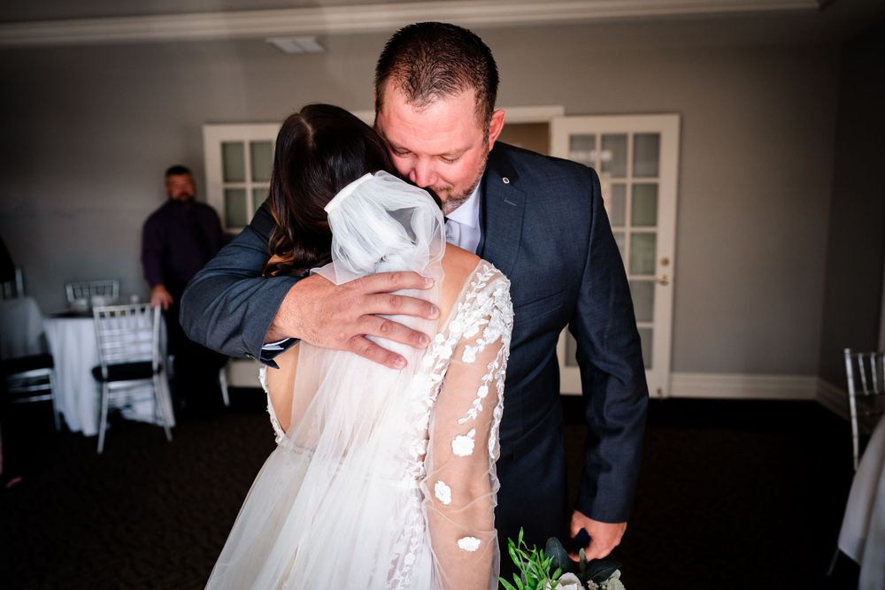 Wedding party members share drinks and laughter during pre-ceremony moments.