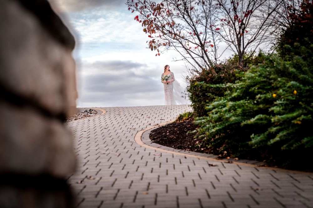 Panoramic view of stone pathway and landscaping at outdoor venue.