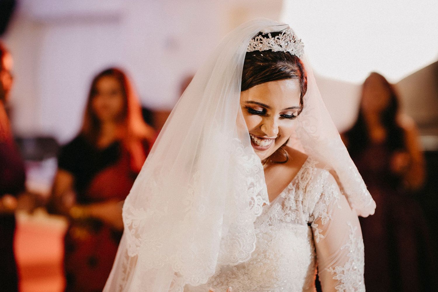 Intimate wedding moments captured in soft lighting during the reception.