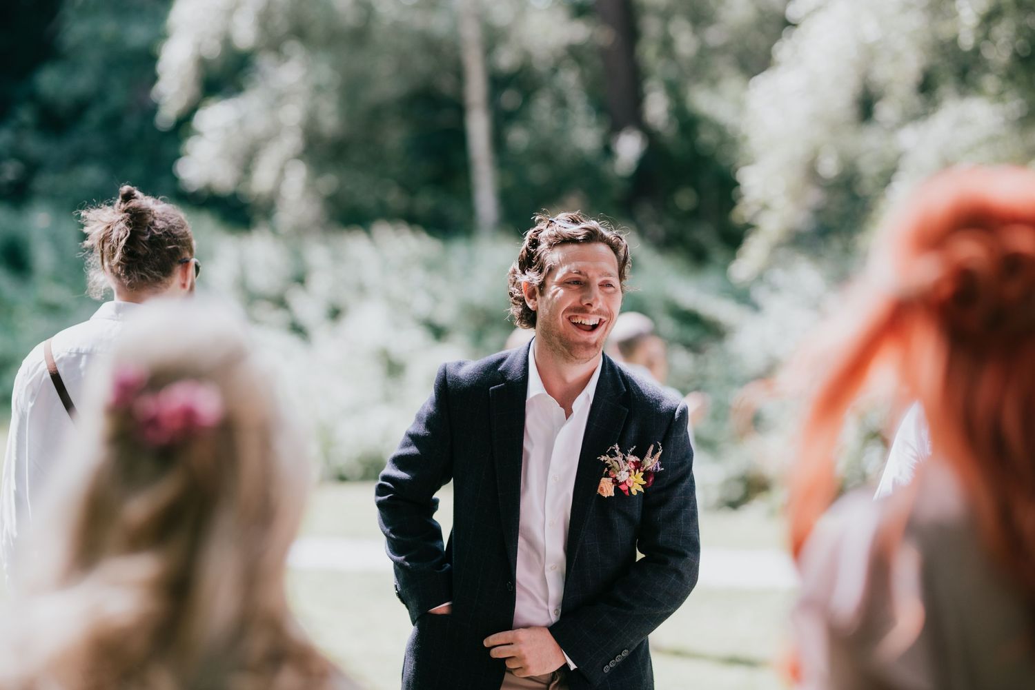 An emotional outdoor wedding moment captured in a candid photography style.
