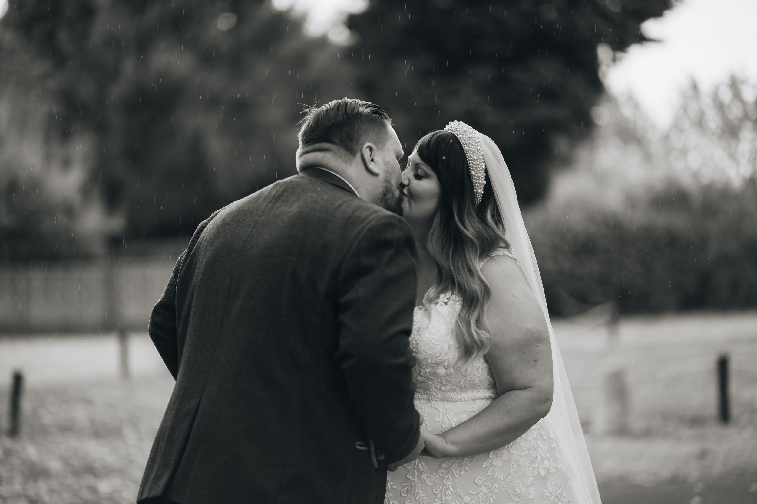A romantic wedding photoshoot featuring an antique rusty truck in the background.