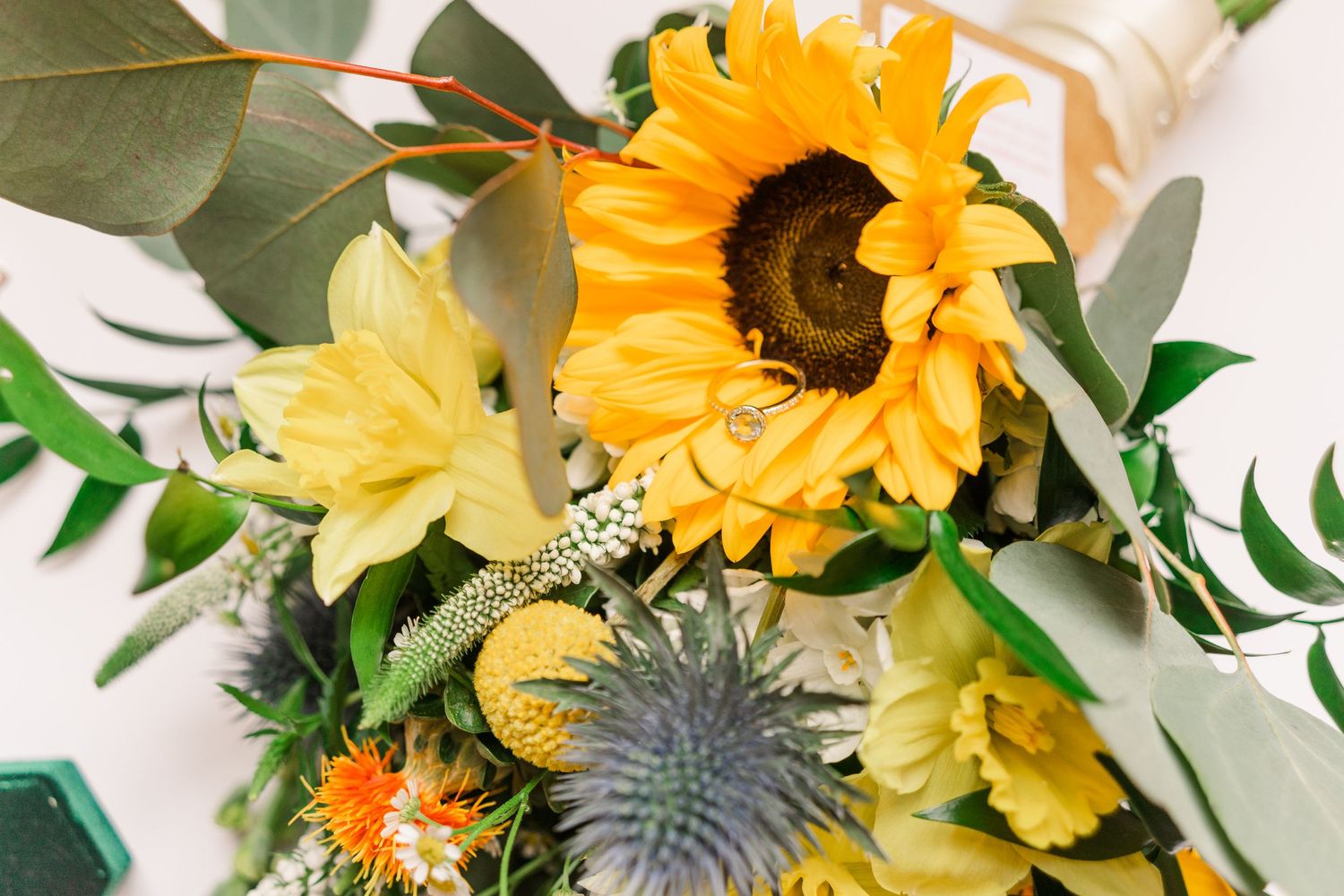 spring wedding bouquet daffodil thistle sunflower
