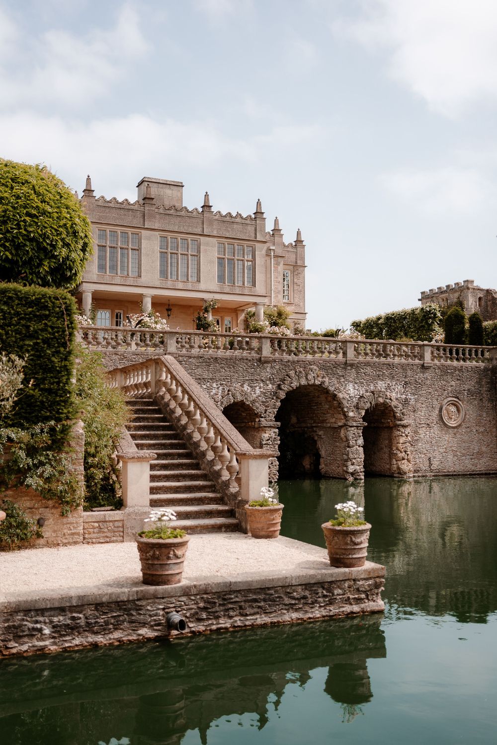 View of the house from the lake at Euridge Manor, Costwolds Wedding Venue