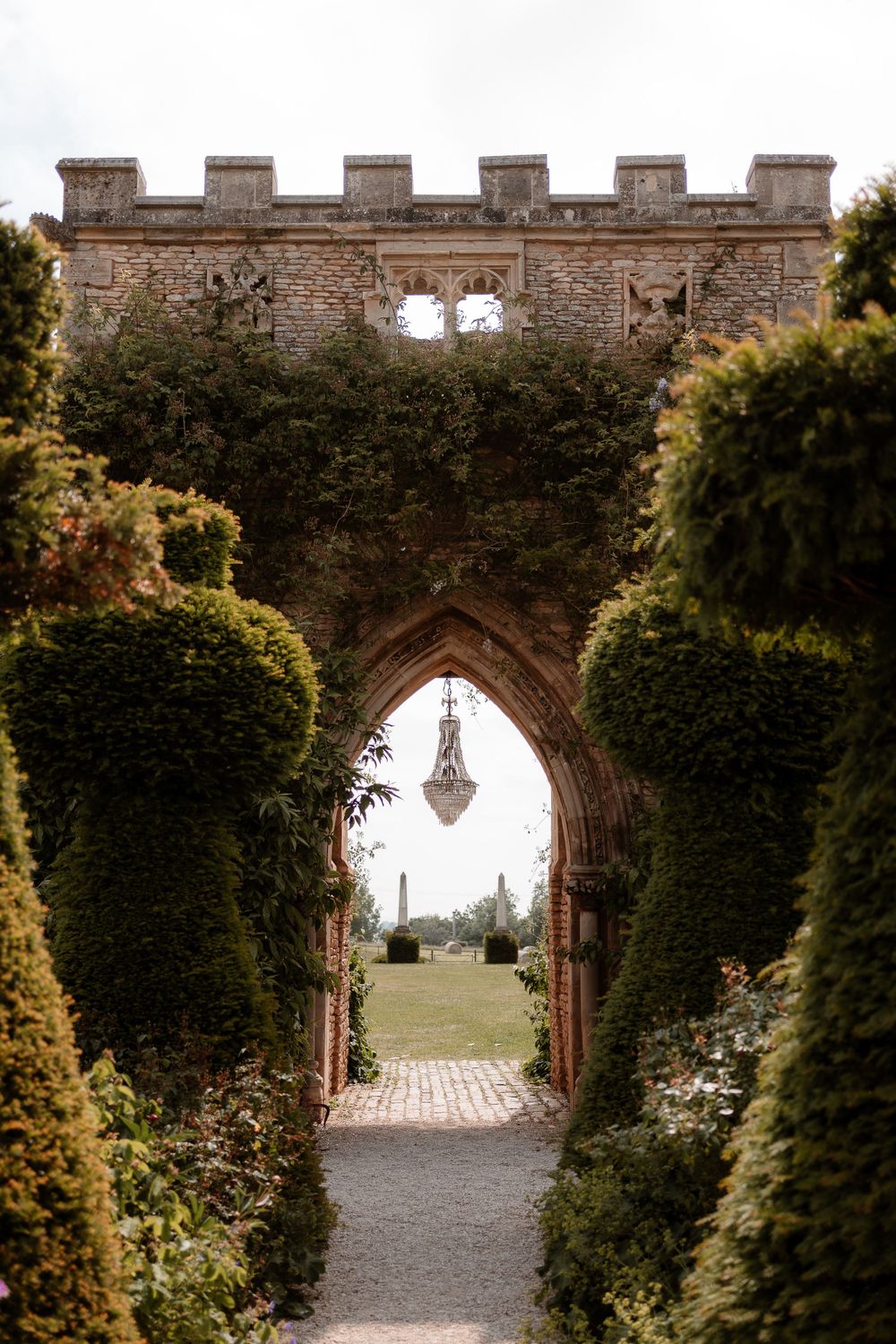 View of the chandelier arch at Euridge Manor, luxury Cotswolds wedding venue.