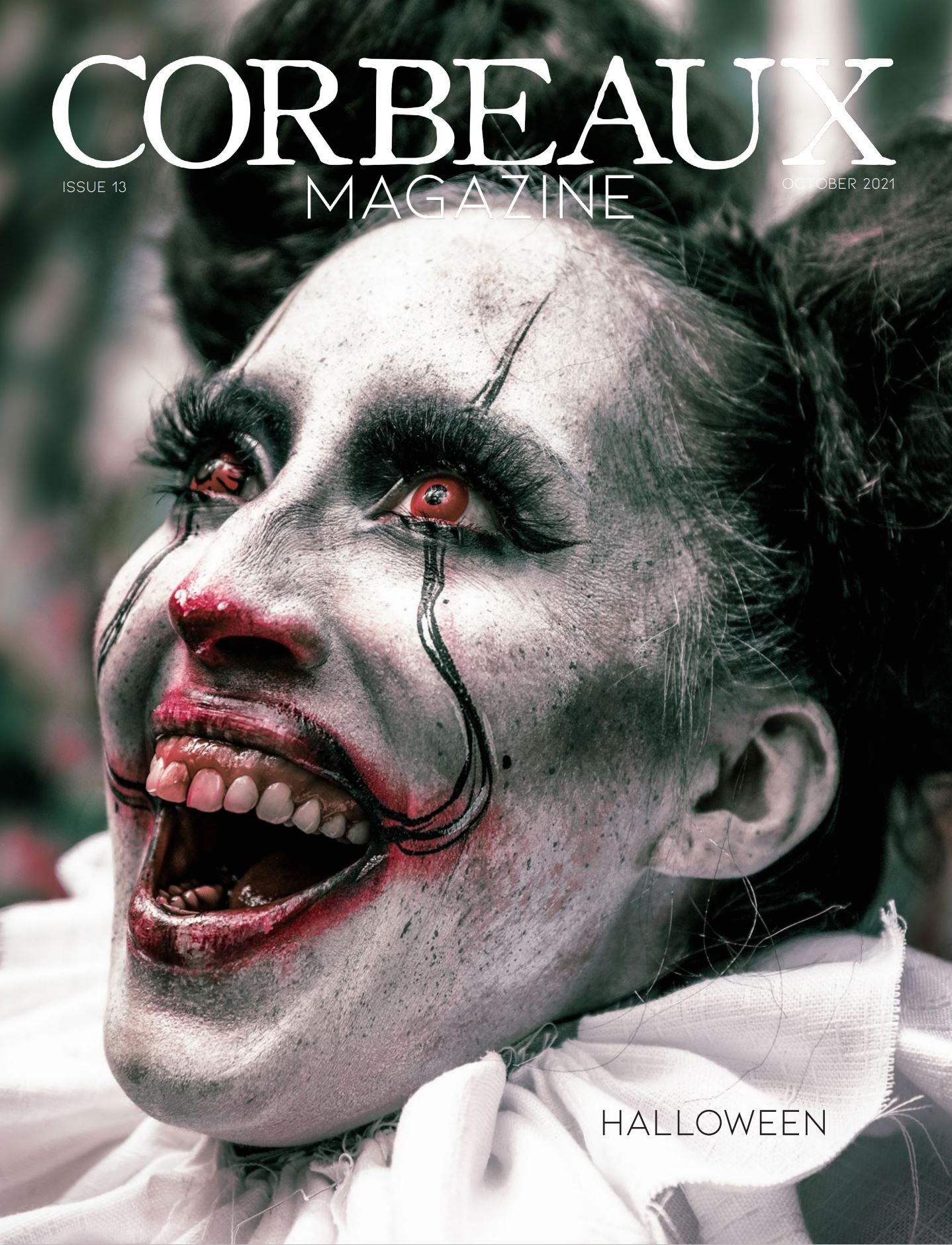 Terrifying clown-inspired model with smeared makeup grins wildly on a Halloween magazine cover. Captured by Chris Cornish Photography.