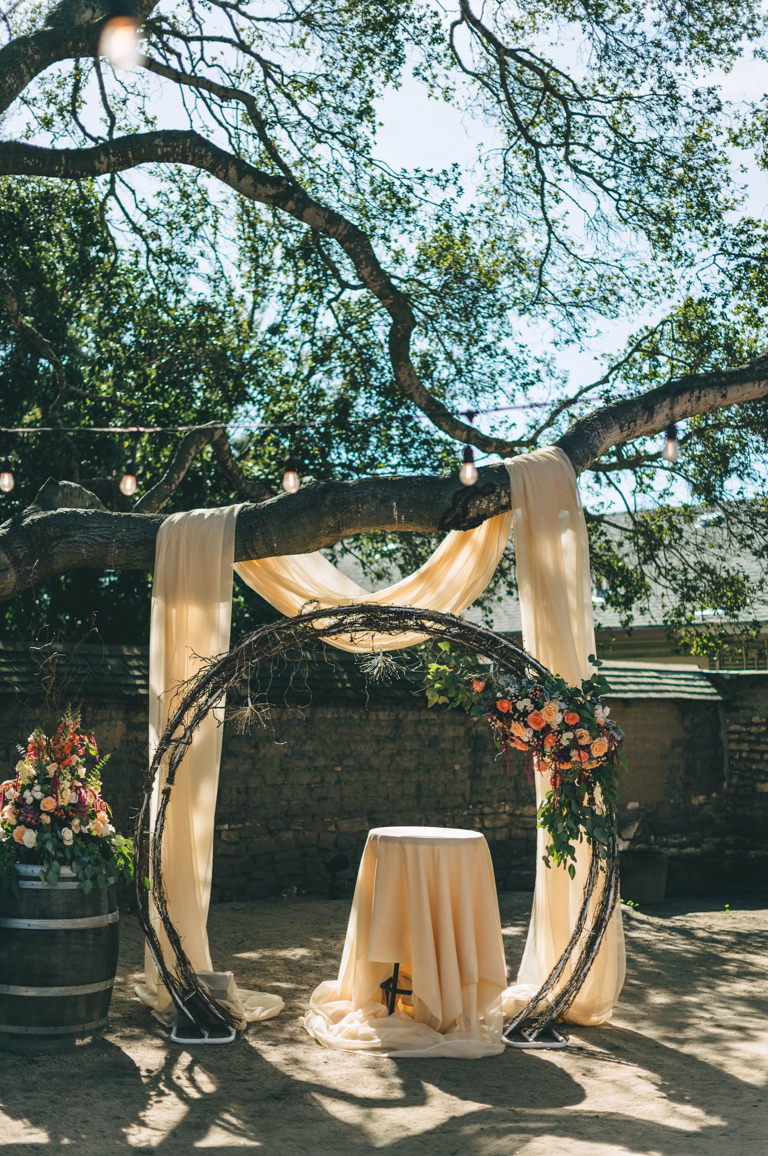 ceremony setup with circular arch at the barns at Cooper Molera in Monterey