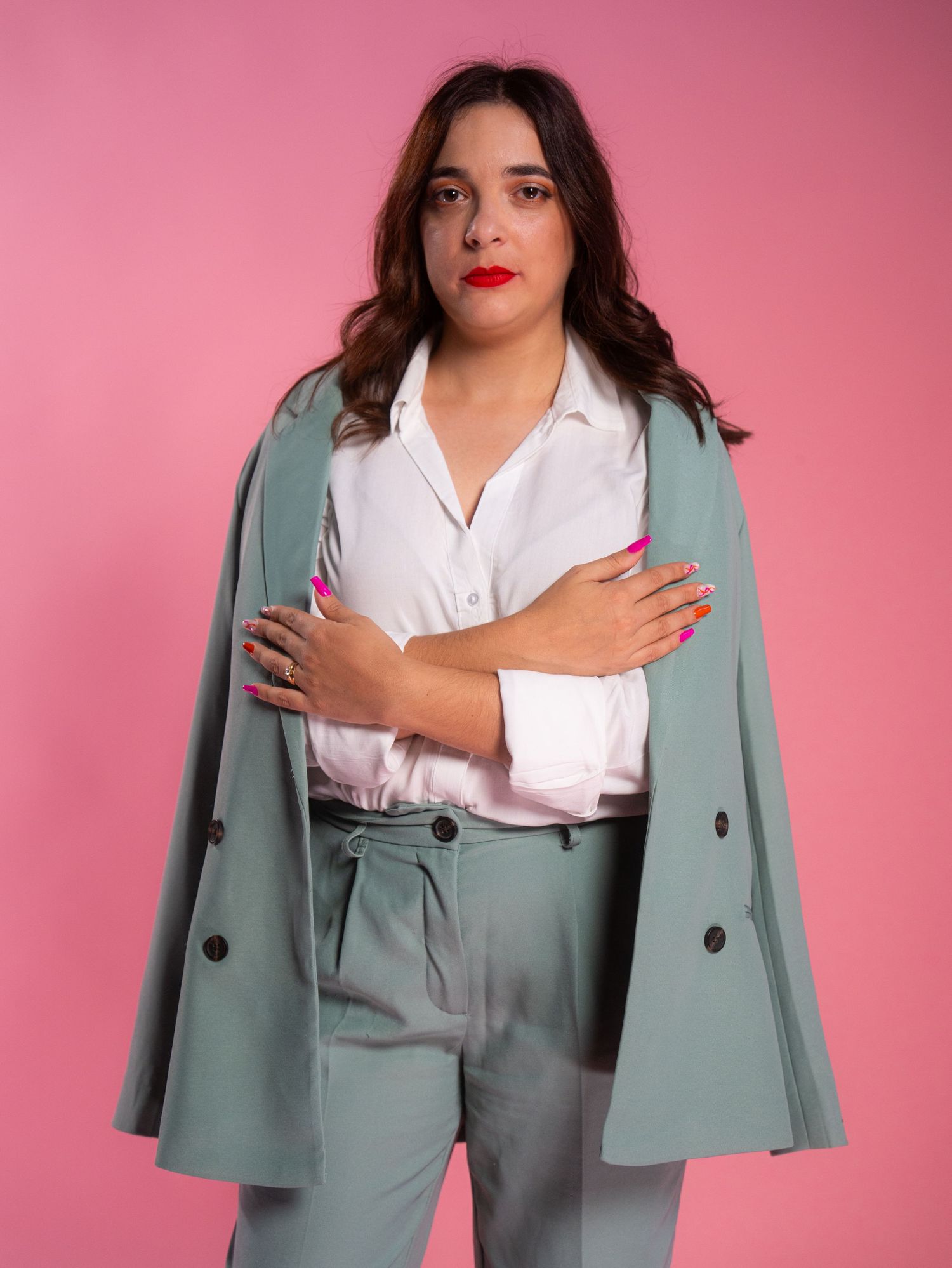 Fashion series showing professional poses in mint green blazer and white button-up shirt.