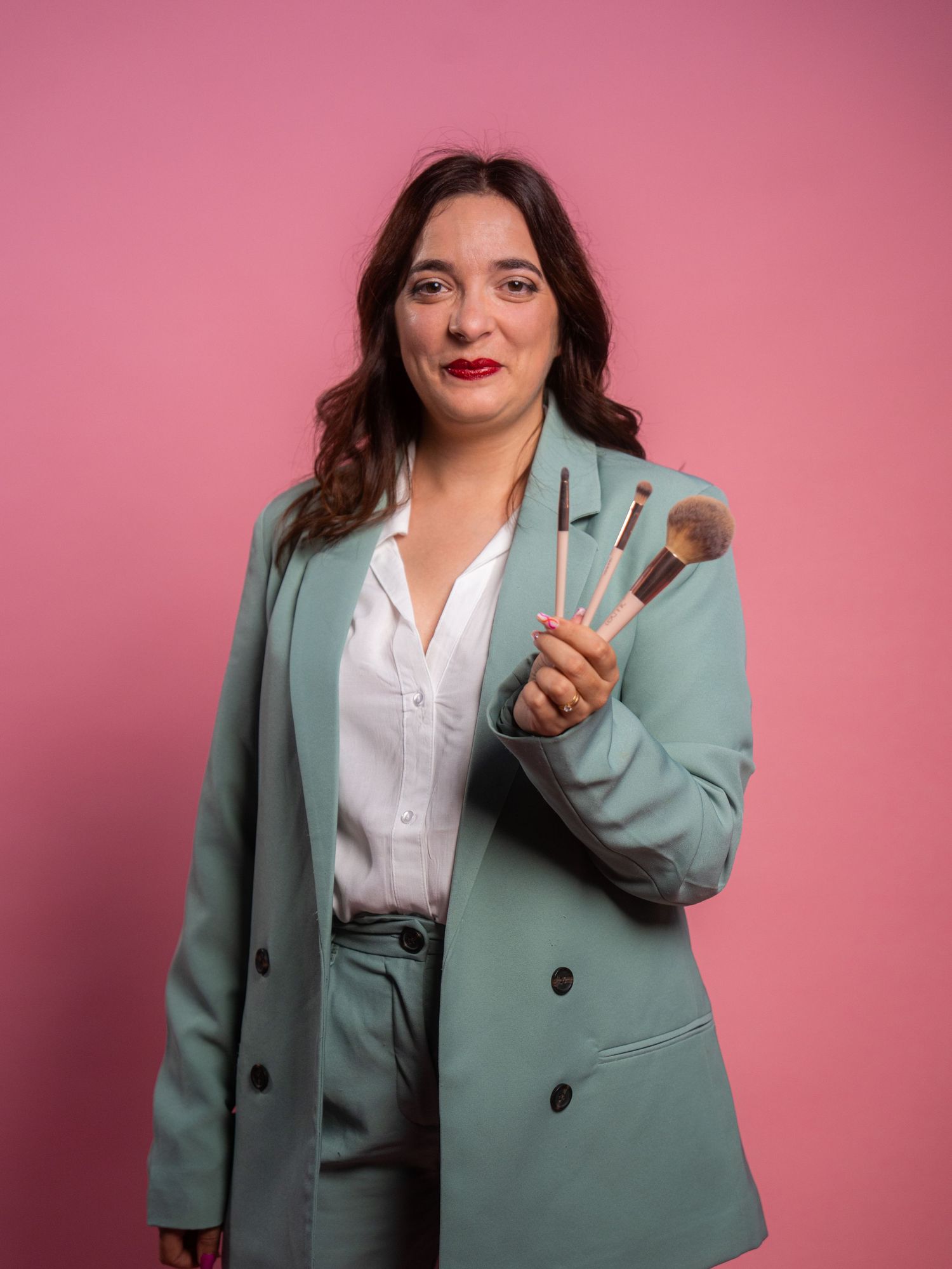 Professional fashion photography series featuring mint green blazer and white blouse ensemble.