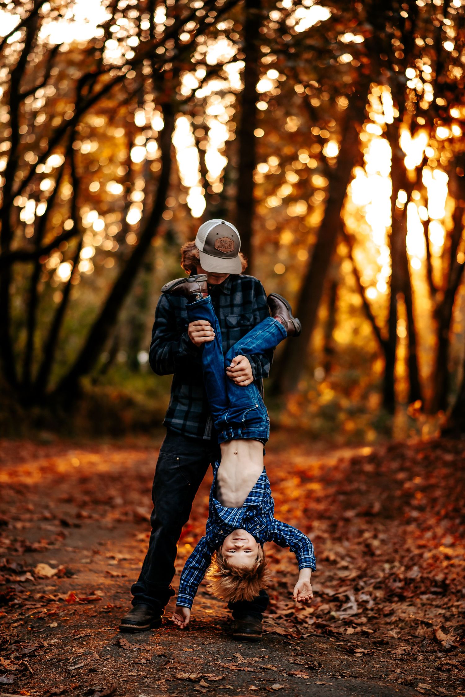 Playful family moments captured in golden sunset light among fallen leaves.