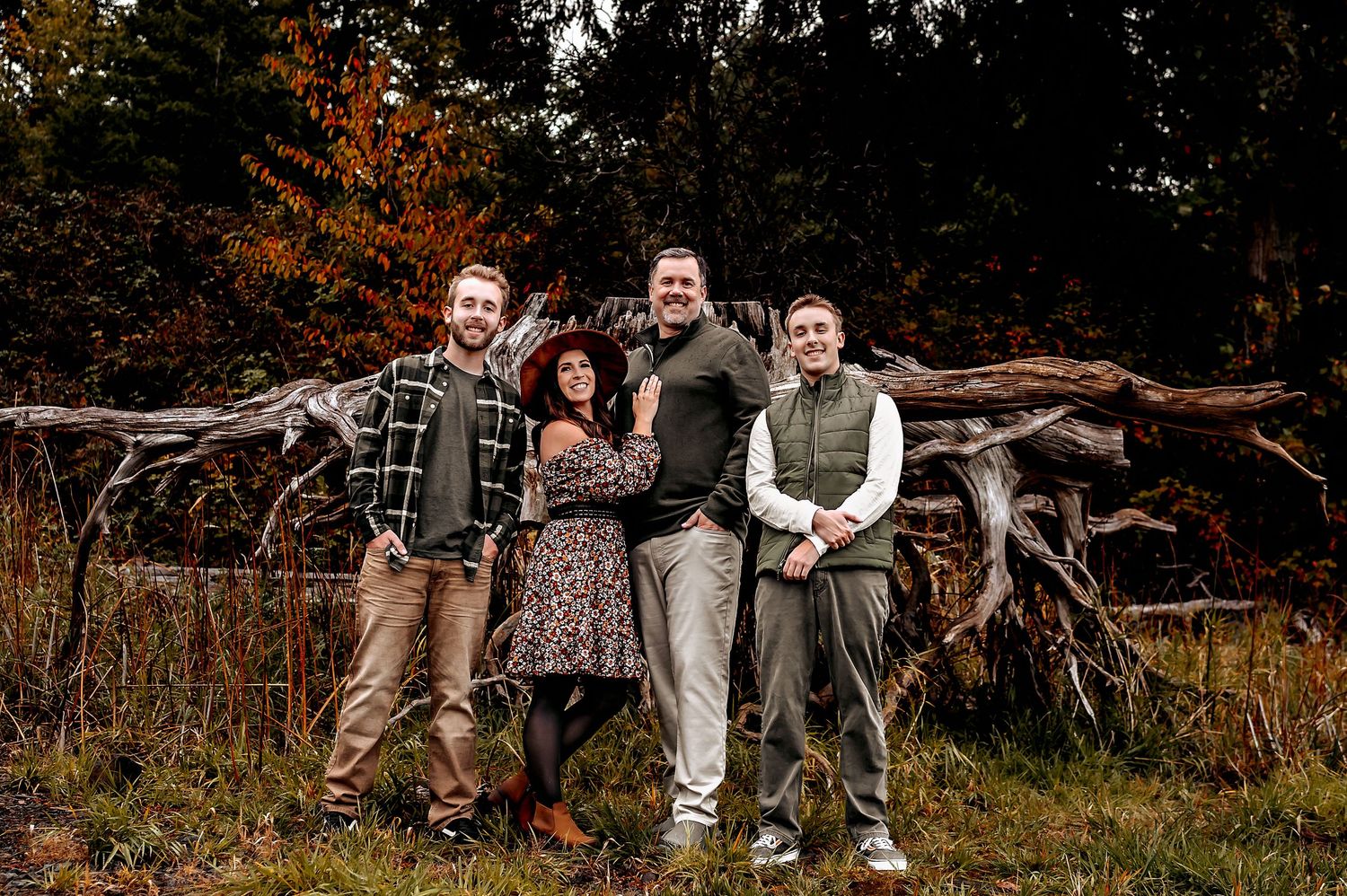 Wide landscape shot of group gathered outdoors during fall season.