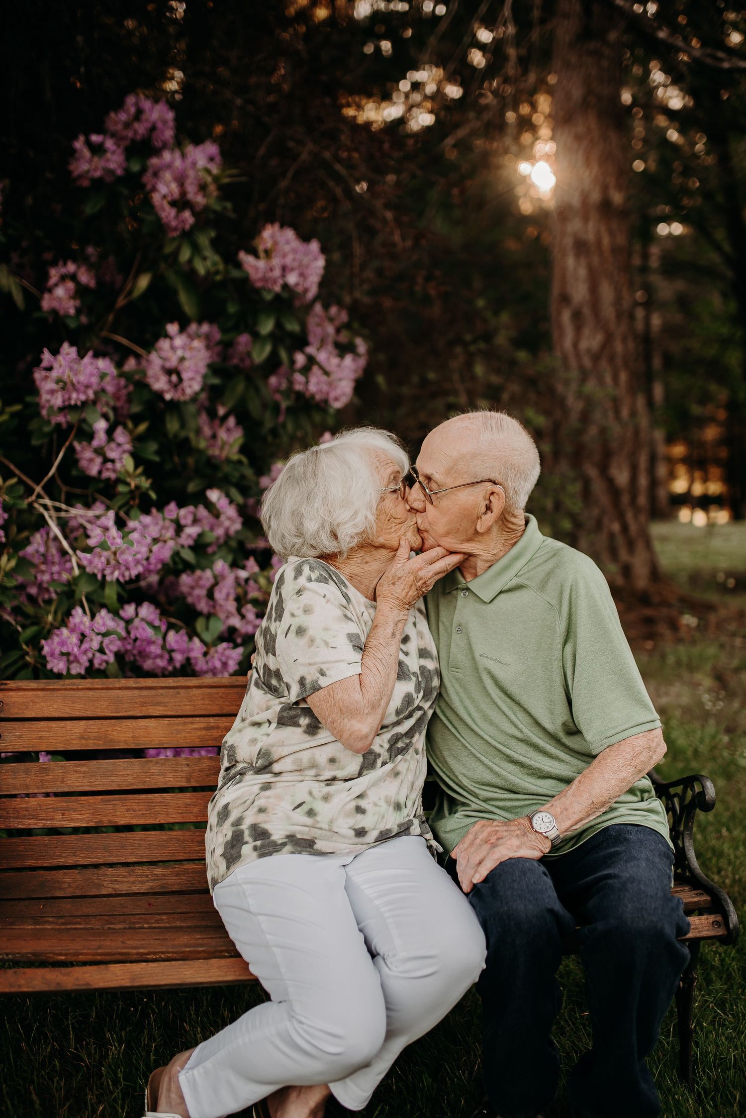 Elderly couple kissing.