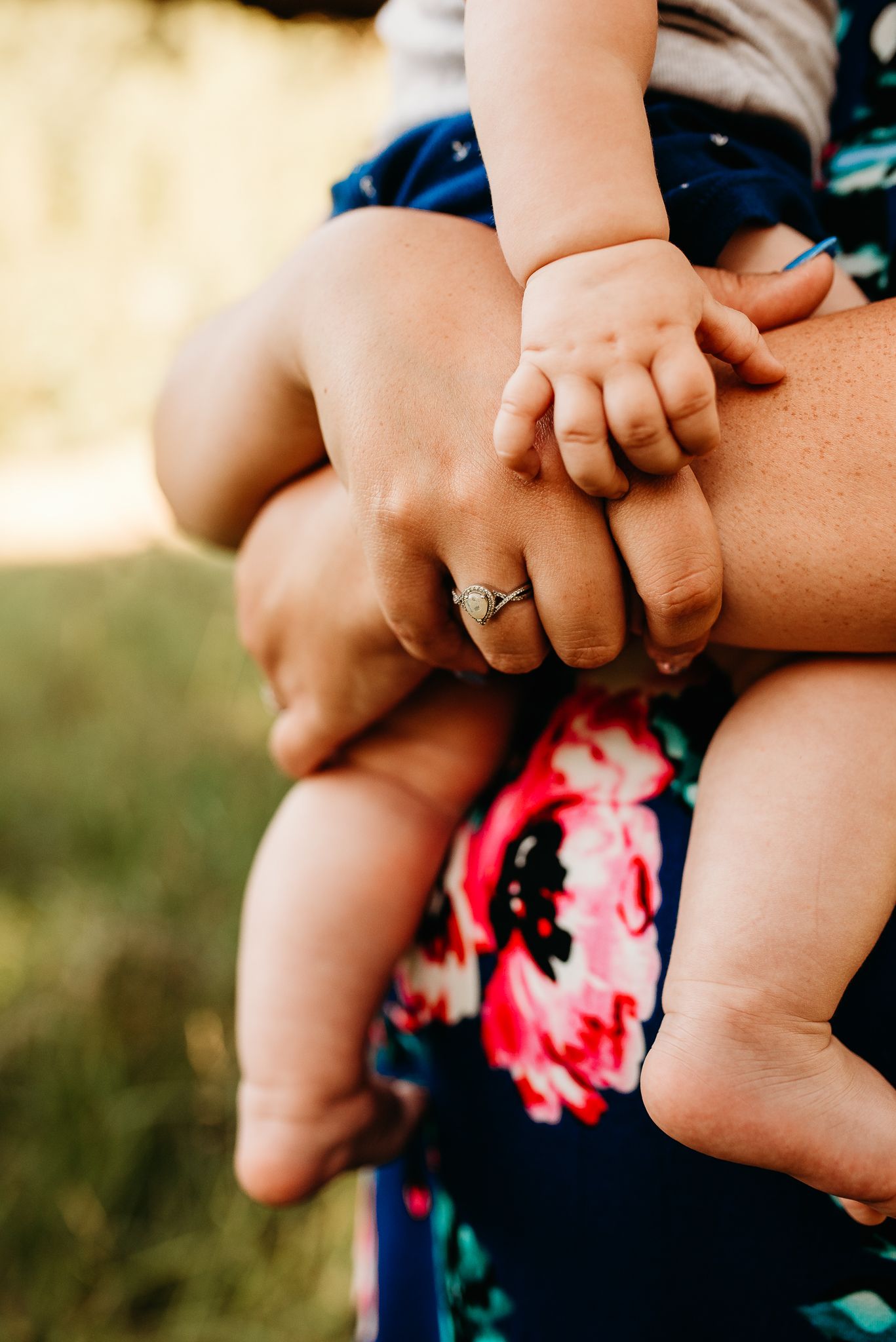 Details of mom and baby's hands.