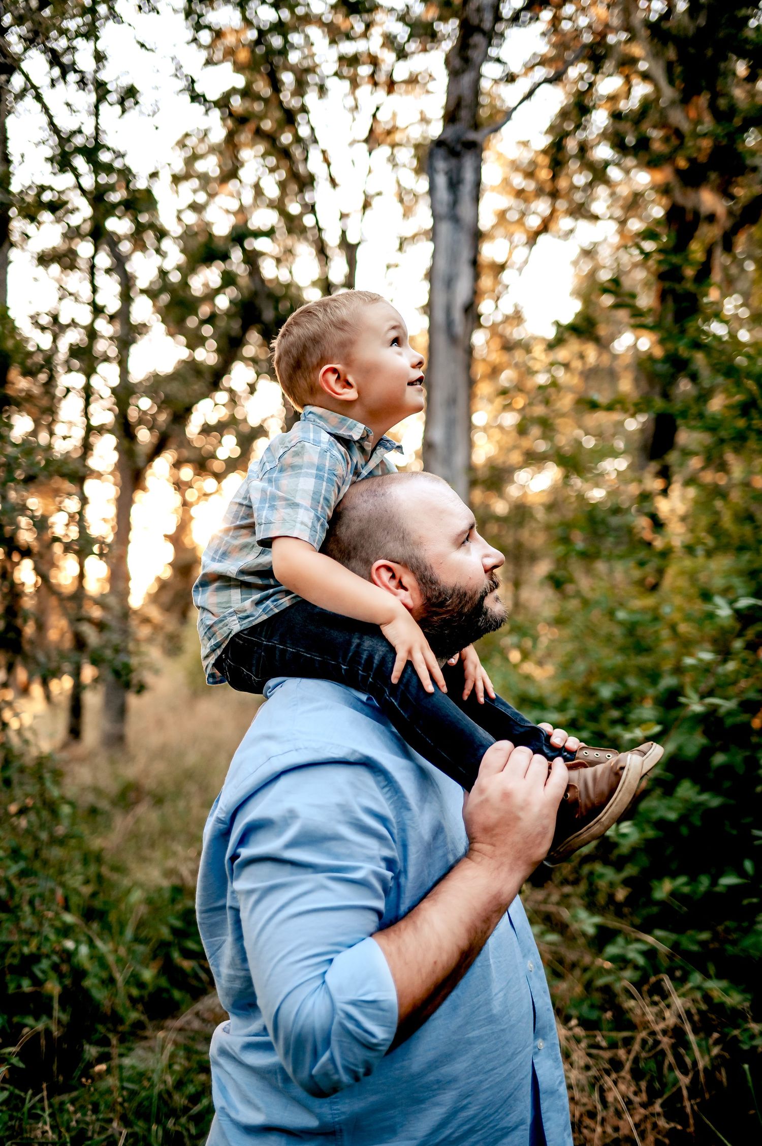 Child on fathers shoulders.