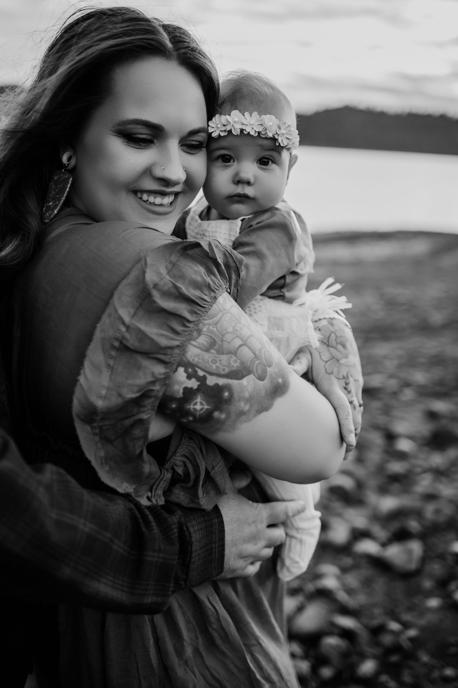 Black and white portrait series capturing intimate moments outdoors.