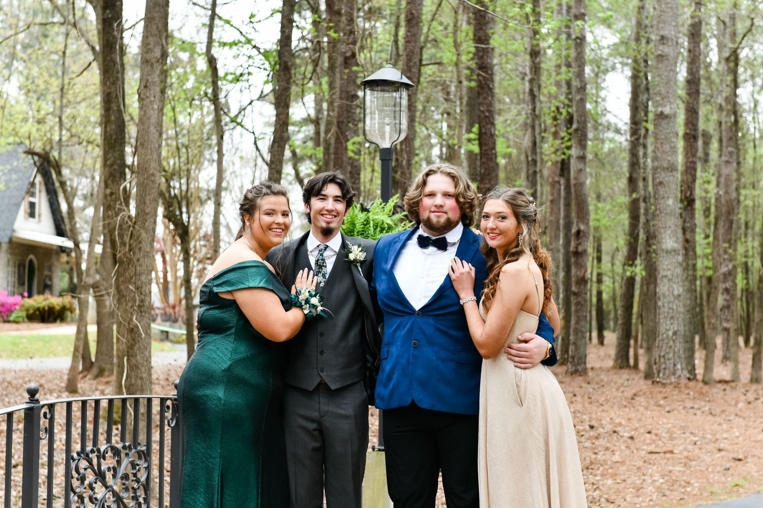 Prom pictures on bridge in woods